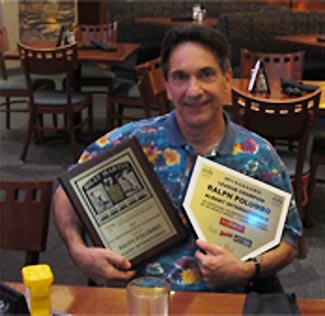 Ralph Polumbo holding awards for 2011 GUSSOMO League Championship, Ultimate Strat Baseball Newsletter